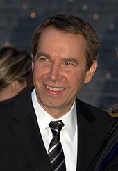 American artist Jeff Koons (pictured in 2009) designed the cover artwork for Artpop. Jeff Koons Shankbone 2009 Vanity Fair.jpg