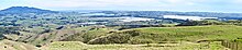 The two main arms of Whaingaroa Harbour, Waitetuna left and Waingaro right, divided by the Paritata Peninsula, with Karioi in the background.