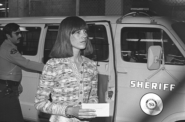 Van Houten arrives at a courthouse for a hearing in December 1976.