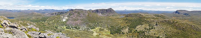 Looking west from Mt Jerusalem. King Davids Peak is centre right. The Temple is in the foreground centre left with Solomon's Throne behind. The peaks behind in the distance are in the Cradle Mountain-Lake St Clair National Park.