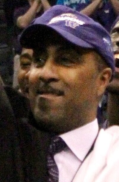 Romar celebrates Washington's 2011 Pac-10 tournament championship.