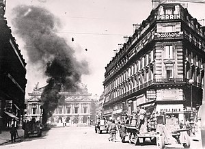 25 August - Armoured vehicles of the 2nd Armored (Leclerc) Division fighting before the Palais Garnier. One German tank is going up in flames. Lot 4568-2 (19583145252).jpg