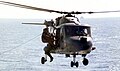 335: Of en:HMS Cardiff (D108) practising Search & Rescue, the pilot shown here, Lt Clayton, was mentioned in dispatches for his actions in the Falklands War.[1]