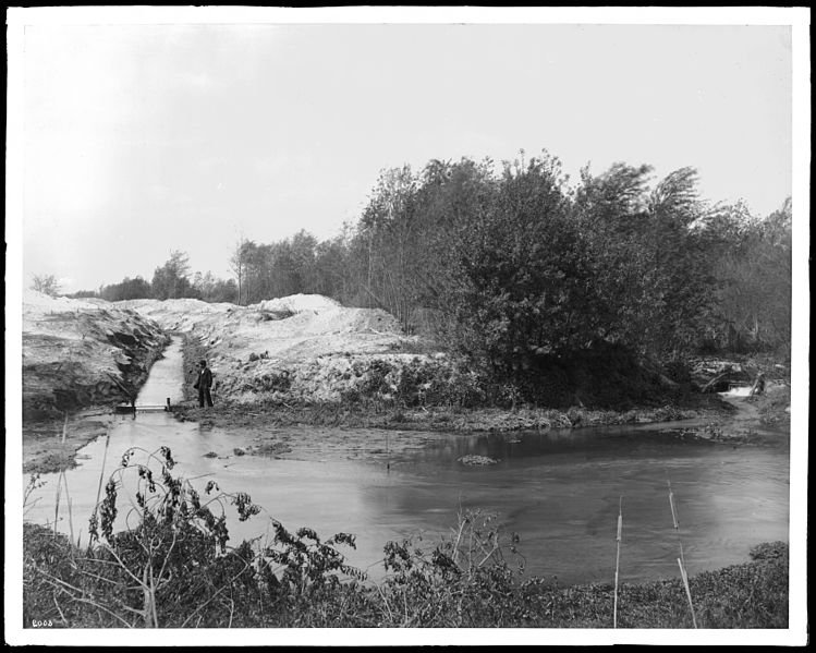 File:Man standing near a water ditch at the bank of Los Angeles River, north side of Griffith Park, ca.1900 (CHS-2008).jpg