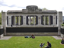 The Tower Hill Memorial comprises two adjacent memorials. Those merchant seafarers who lost their lives in World War II are commemorated on the walls of the sunken garden in the foreground while those who died in World War I are listed on the walls of the pavilion in the background. Merchant Navy Memorial - north elevation and sunken gardens 02.jpg
