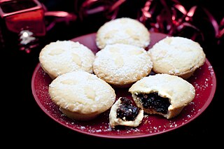 A mince pie is a sweet pie of English origin, filled with a mixture of dried fruits and spices called 