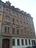 Apartment building in half-open development