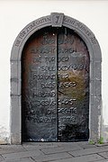 Cultural heritage monuments in Moselkern: door beside the church covered with copper plates by Adolph Steines 1969