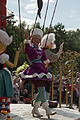 * Nomination Disney character Pinocchio showing at the Disney Magic On Parade at Disneyland Paris. --Medium69 12:02, 8 August 2016 (UTC) * Decline This time she is leaning back so that her whole upper body is in shadow and Geppetto's well-lit head right beside her is stealing the attention. The half doll isn't helping either, sorry. W.carter 21:01, 8 August 2016 (UTC)