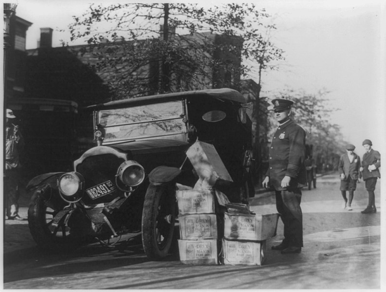 File:Policeman and wrecked car and cases of moonshine.jpg