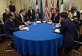 U.S. Secretary of State John Kerry listens as President Obama joins European leaders in a discussion with Ukrainian President Petro Poroshenko before the NATO Summit in Newport, Wales, on September 4, 2014.