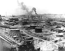 The first Standard Oil refinery was opened in Cleveland by businessman John D. Rockefeller. Standard Oil.jpg