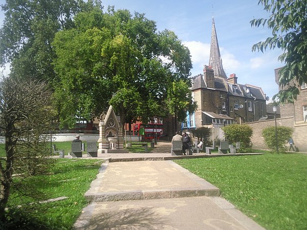 Streatham Green with the spire of the Catholic English Martyrs Church beyond.