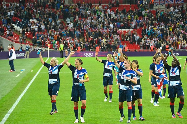 Team GB celebrating following victory against Brazil in their final group game