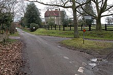 Public junction and approach to a more elaborate than usual farmhouse - the area is archetypically lined with trees. Upton Farm, Elmley Lovett - geograph.org.uk - 136446.jpg