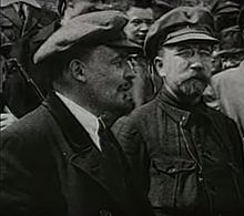 Lenin wearing his signature cap, 1920s Vladimir Lenin and Lev Kamenev.jpg