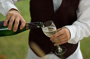 Waiter pouring a drink