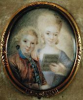 Portrait of a boy (left) and his older sister