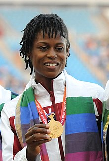 XIX Commonwealth Games-2010 Delhi (Women's) Athletics Long Jump Alice Falaiye of Canada (Gold), during the medal presentation ceremony (cropped).jpg