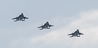 A formation of three F-15C/D Eagles overhead Kadena Air Base in Okinawa, Japan. The aircraft are assigned to the 18th Wing.