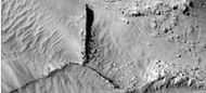 Narrow ridges, as seen by HiRISE under HiWish program. The ridges may be the result of impacts fracturing the surface.