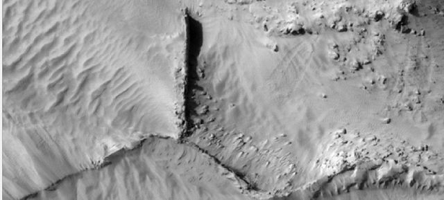 Narrow ridges, as seen by HiRISE under HiWish program. The ridges may be the result of impacts fracturing the surface.