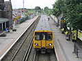 A Merseyrail Class 508 at the station, with a service to Liverpool Central.