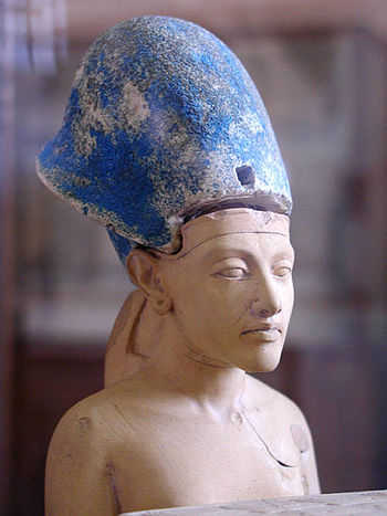 Small statue of Ahkenaten wearing the blue crown