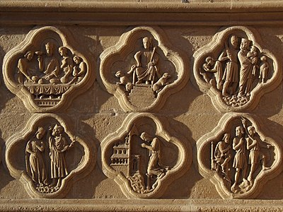 Ces bas-reliefs du soubassement du portail de droite (de la Mère-Dieu) de la façade occidentale se trouvent sous les statues des rois Salomon et Hérode et datent du début du XIIIe siècle[21].