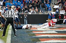 Taylor (right) scoring a touchdown for Louisiana Tech in the 2016 Armed Forces Bowl Armed Forces Bowl XIV (161223-G-CZ043-1313).jpg