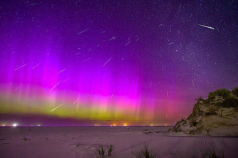 Perseids and aurora at the beach of Norderney, Germany. The perseids are stitched together from 64 individual exposures but their position in the sky was not changed in the process.