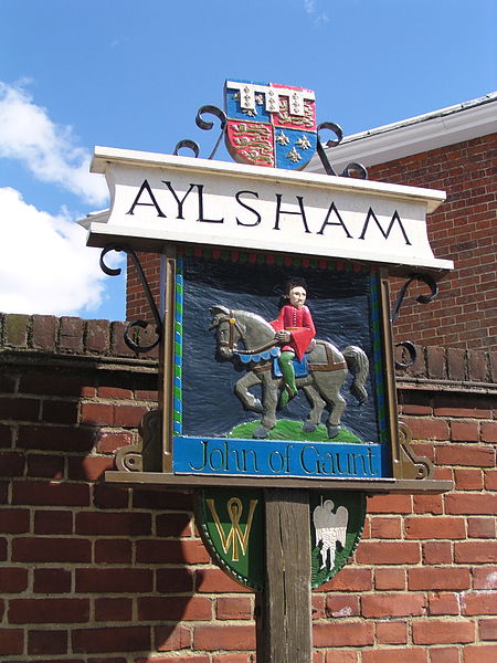 Aylsham town sign, typical of many Norfolk village signs, stands at the entrance to the town. It depicts John of Gaunt, Lord of the manor from 1372.