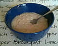 Bowl of porridge with spoon.jpg