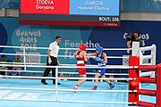 Deutsch: Boxen bei den Olympischen Jugendspielen 2018 Tag 12, 18. Oktober 2018 - Kampf um die Bronzemedaille im Fliegengewicht Mädchen – Heaven Destiny Garcia (USA, blau) schlägt Goryanana Stoeva (Bulgarien, rot) 5-0; Ringrichter ist Ishanguly Meretnyyazov (Turkmenistan). English: Boxing at the 2018 Summer Youth Olympics on 18 October 2018 – Girl's flyweight Bronze Medal Bout - Heaven Destiny Garcia (USA, blue) beats Goryanana Stoeva (Bulgaria, red) 5-0; Referee is Ishanguly Meretnyyazov (Turkmenistan). Español: Boxeo en los Juegos Olímpicos Juveniles de Verano de 2018 en 18 de octubre de 2018 - Combate a medalla de bronce de peso mosca para mujeres: Heaven Destiny Garcia (Estados Unidos, azul) le gana a Goryanana Stoeva (Bulgaria, roja) 5-0; El árbitro es Ishanguly Meretnyyazov (Turkmenistán).