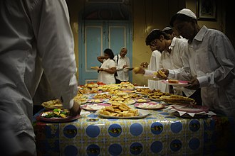 Jews in Mumbai break the Yom Kippur fast with roti and samosas Breaking of Yom Kippur fast with Roti and Samosas (8034851404).jpg
