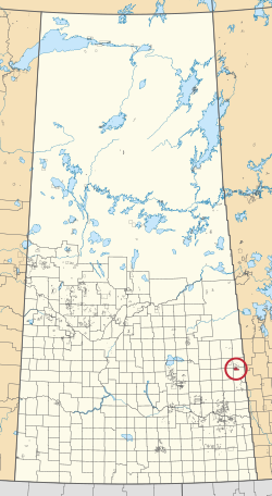 Saskatchewan vilayetinin 297 kırsal belediyesini ve yüzlerce küçük Kızılderili rezervini gösteren bir haritası. Biri kırmızı bir daire ile vurgulanmıştır.