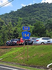 Southbound sign between Achiote and Naranjito barrio-pueblo