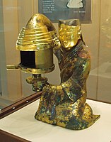 A gilt bronze lamp with a shutter, in the shape of a maidservant, from the Western Han dynasty, 2nd century BC