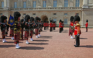 Members of the pipe band outside Buckingham Palace, June 2014. Changing of the Guard at Buckingham Palace (14752804365).jpg