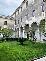 Portico of the Cloister of St. Peter Alli Marmi, covered with groin vaults supported by semicircular arches. Cloister of the Basilica of St. Peter alli Marmi.jpg