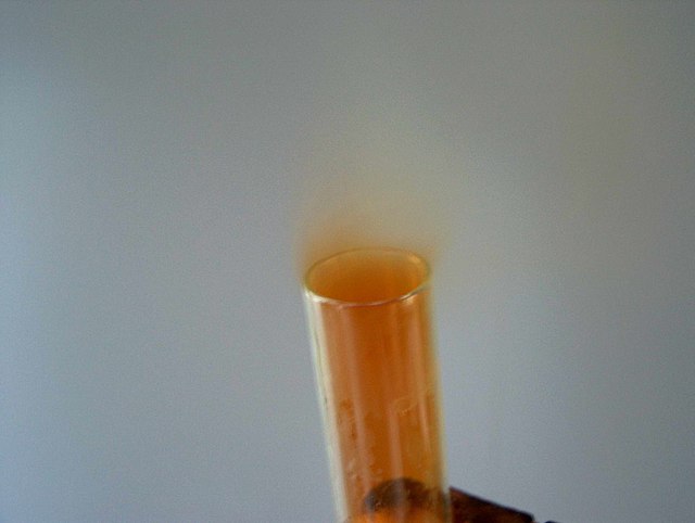 Nitrogen dioxide being released from a test tube