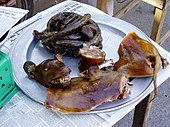 A dog meat platter found in a street market a few kilometres east of Hanoi, Vietnam Dog meat.jpg