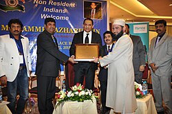 Dr. Najeeb Qasmi receiving memento from previous Indian Cricket Team Captain Mohammad Azharuddin on 8 April 2015.jpg