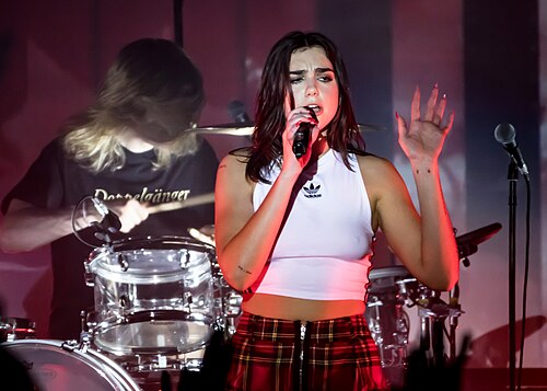 Dua Lipa performing "New Rules" during The Self-Titled Tour in 2018. Dua Lipa 02 08 2018 -85 (38944431850).jpg