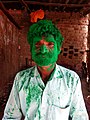 Indian man playing Hinduism festival Holi