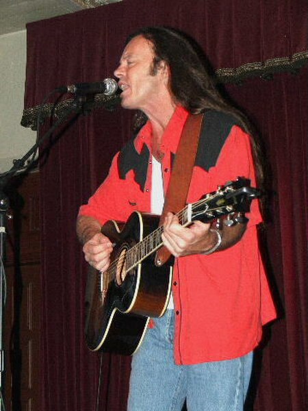 Kevin Welch at Cactus Cafe in Austin, Texas. Photo by Ron Baker (2005).