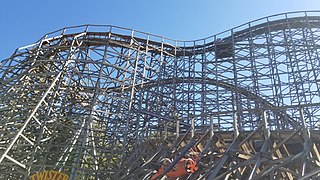 The swoop curve and first drop as viewed from ground level