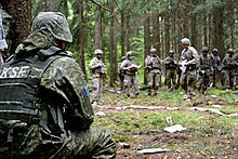 A Kosovo Security Force Soldier watches troop commanders from 5th Squadron, 7th Cavalry Regiment walk through a combined arms rehearsal as part of Combined Resolve VI at Hohenfels, Germany. Kosovo Security Forces join War Paint Squadron for Combined Resolve 160517-A-CY863-153.jpg