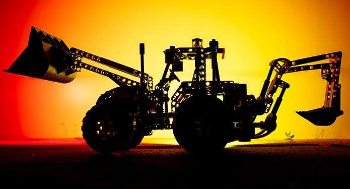 Silhouette of a LEGO Technic Backhoe Loader model 8069