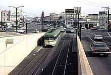 An outbound L Taraval PCC entering the (now demolished) eastern portal of the Twin Peaks Tunnel - the original Muni subway segment, February 1967 MUNI 1149 East Portal Feb 1967xRP - Flickr - drewj1946.jpg